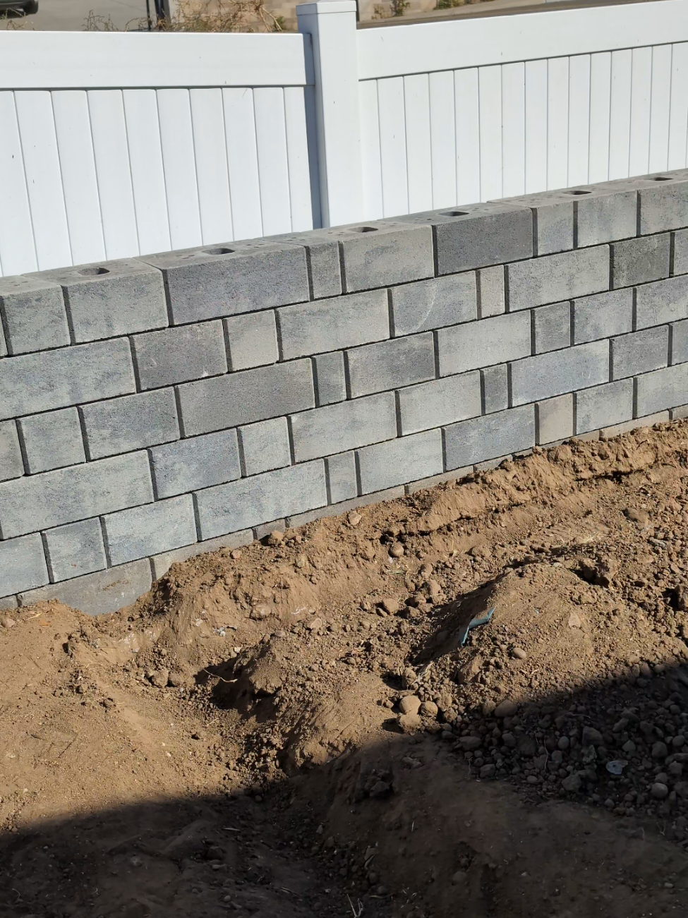 Architectural Segmental Retaining Wall Systems: Multi-Height Ashlar Blocks & Vinyl Fence Integration in San Diego