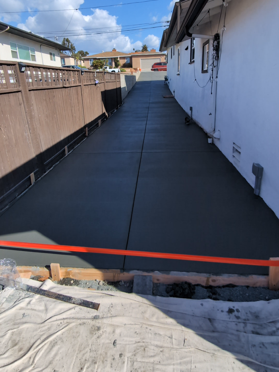 Long Side-Yard Concrete Driveway Pouring in San Diego: Broom Finish, Rebar & Slope Drainage