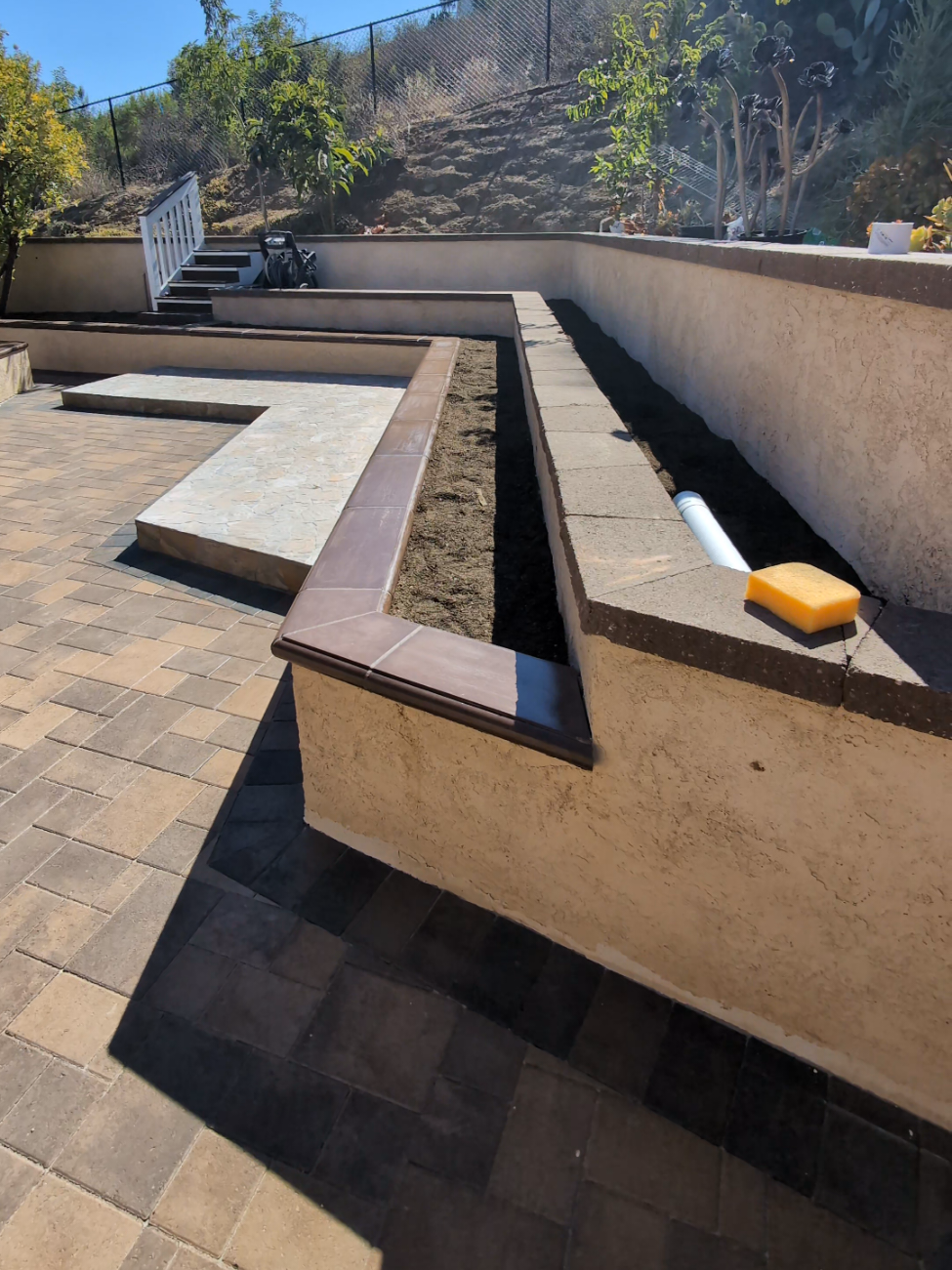 Tiered Retaining Walls, Stucco Planters & Paver Patios in San Diego: Hillside Renovation